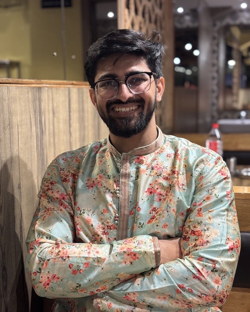 Portrait of Rahul Yadav smiling in a floral kurta.